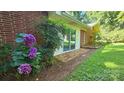 Lovely brick home with colorful hydrangeas and a brick patio at 7021 Linda Lake Dr, Charlotte, NC 28215