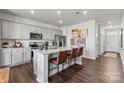 Modern kitchen featuring an island with bar seating, stainless steel appliances, and stylish decor at 710 Olde England Dr, Lincolnton, NC 28092