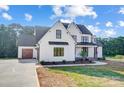Beautiful two-story modern farmhouse with a three car garage and an inviting front porch at 762 Highway 274 Hwy, Clover, SC 29710