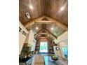 Bright kitchen featuring custom cabinets, an island, and a vaulted, beamed, wood ceiling at 762 Highway 274 Hwy, Clover, SC 29710