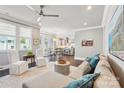 Bright living room featuring a neutral palette, wood floors, and an open layout flowing into the kitchen at 7908 Rea View Ct, Charlotte, NC 28226