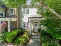 Beautiful home featuring a well-kept lawn, American flag, and lovely landscaping at 815 Jetton St, Davidson, NC 28036