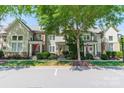 Charming home featuring manicured lawn, a well-paved driveway, and lovely landscaping at 815 Jetton St, Davidson, NC 28036