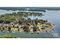 Beautiful home with private dock nestled among mature trees on a serene lakefront property at 9561 Island Point Rd, Sherrills Ford, NC 28673