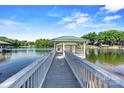 Lakeside covered dock featuring a charming gazebo with seating and picturesque water views at 9561 Island Point Rd, Sherrills Ford, NC 28673