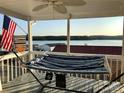 Relaxing porch with hammock and view of the lake at 108 Britt Ln, New London, NC 28127