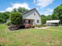 Charming home exterior featuring a cozy front porch and well-maintained landscaping at 1111 Unionville Church Rd, Monroe, NC 28110