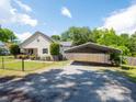 Exterior view shows house and covered parking with a long driveway at 1111 Unionville Church Rd, Monroe, NC 28110
