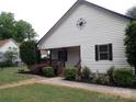 Charming home featuring white siding, manicured landscaping, and a welcoming front porch at 1111 Unionville Church Rd, Monroe, NC 28110