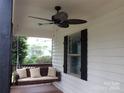 Inviting front porch featuring a cozy porch swing and a ceiling fan for relaxation at 1111 Unionville Church Rd, Monroe, NC 28110