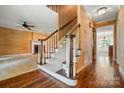Inviting entryway with staircase, hardwood floors, and classic decor at 1295 Patterson St, China Grove, NC 28023