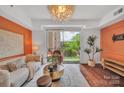 Bright living room with modern furnishings and balcony access at 1315 East Blvd # 410, Charlotte, NC 28203