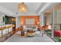 Open-concept living area with designer lighting and balcony at 1315 East Blvd # 410, Charlotte, NC 28203