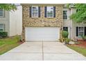 A spacious two car garage with well manicured lawn at 1332 Waterlily Ln, Charlotte, NC 28262