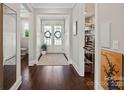 Elegant foyer with dark wood floors, double doors, and a view of the walk-in pantry at 136 Preston Rd, Mooresville, NC 28117