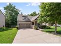 Lovely home boasts a spacious driveway and attached garage providing convenience and ample parking at 14512 Brotherly Ln, Charlotte, NC 28278