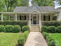 Charming craftsman home with a covered front porch and well-manicured landscaping at 1915 Winthrop Ave, Charlotte, NC 28203