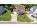 An aerial view showcases the home's landscaping, driveway, and surrounding neighborhood at 197 Devon Forest Dr, Mooresville, NC 28115