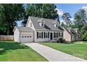 Attractive home with a well-manicured lawn, a one car garage, and concrete driveway at 20840 Sierra Vista Dr, Cornelius, NC 28031