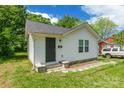 Cozy one-story home showcasing a freshly painted exterior, neat landscaping, and welcoming front entrance at 211 E Mcneely Ave, Mooresville, NC 28115