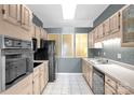 Charming kitchen featuring ample cabinetry, tiled floors, and modern appliances at 235 Pebble Point Rd, Salisbury, NC 28146
