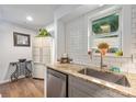 Bright kitchen with stainless steel appliances, granite countertops and subway tile backsplash at 415 W 7Th St # F, Charlotte, NC 28202