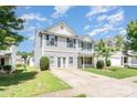 Inviting two-story home with a well-manicured lawn and a concrete driveway at 5141 Grays Ridge Dr, Charlotte, NC 28269