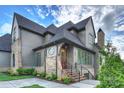 Charming two-story home with gray siding, brick accents, multiple windows, and a welcoming front entrance at 536 Hillside Ave, Charlotte, NC 28209