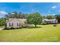 Front exterior of a house with a large yard and neighbor's house at 5678 Cedar Run Dr, Denver, NC 28037