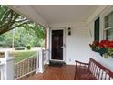 View of the front porch featuring a bench, flower box, and white railings at 723 Rabun Ln, Rock Hill, SC 29730