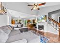 Spacious living room flows into kitchen, featuring a cozy fireplace at 7321 Mapleridge Dr, Charlotte, NC 28210