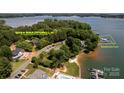 Beautiful aerial view showcasing the property's boundaries, lake access, and deeded boat slip at 8024 Bradford Ln, Denver, NC 28037