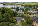 Stunning aerial view of lakefront property with mature trees and access to boating and recreational activities at 8024 Bradford Ln, Denver, NC 28037