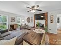 Cozy living room features a brick fireplace and comfortable seating arrangement at 824 Balsam Ter, Charlotte, NC 28214