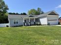 Attractive single-story home with lush green lawn and a two-car garage at 1119 Balls Creek Rd, Claremont, NC 28610