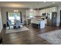 Modern open kitchen featuring stainless steel appliances and an island with bar seating at 1119 Balls Creek Rd, Claremont, NC 28610