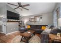 Cozy living room with a plush sectional sofa, decorative wall art, and a ceiling fan at 1774 Smyrna Ln, Catawba, NC 28609