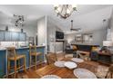 Open-concept living space featuring a dining area, living room with a large couch, and modern lighting at 1774 Smyrna Ln, Catawba, NC 28609