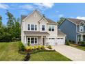 Stunning two-story home with attached two-car garage and manicured landscaping at 1918 Thoreau Way, York, SC 29745