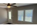 Bright living room with wood-look floors, ceiling fan, and natural light at 203 Blanche Ave, Belmont, NC 28012