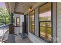 Inviting front porch with charming details and a glimpse of the surrounding neighborhood at 216 S Clarkson St # E, Charlotte, NC 28202