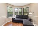 Bright living room area with large windows and a comfortable sofa, perfect for relaxing and entertaining at 216 S Clarkson St # E, Charlotte, NC 28202