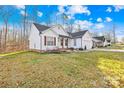 Exterior showcasing this lovely home with wood accents and well-maintained landscaping and lawn at 242 Delview Dr, Cherryville, NC 28021