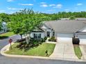 Charming single-story home featuring a lush front yard, driveway, and attached garage in a well-maintained community at 28129 Song Sparrow Ln, Fort Mill, SC 29707