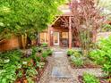 Picturesque backyard boasts a stone patio, lush landscaping, and privacy at 3044 Luke Crossing Dr, Charlotte, NC 28226