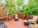 Relaxing wooden deck features comfortable seating and a lush, private view at 3044 Luke Crossing Dr, Charlotte, NC 28226