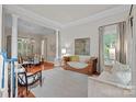 Elegant living room with hardwood floors, decorative moldings, and stylish furnishings at 3524 Rhett Butler Pl, Charlotte, NC 28270