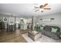 Open-concept living space featuring a kitchen island, a dining area, and comfortable seating at 386 Greenlea Cir, Taylorsville, NC 28681