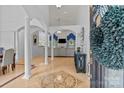 Elegant foyer showcasing soaring ceilings, decorative columns, and a view into the living space at 400 Maymont Dr, Cramerton, NC 28032