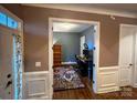 Home office with wood floors, a gray accent wall, and functional workspace at 4006 Tremont Dr, Indian Trail, NC 28079